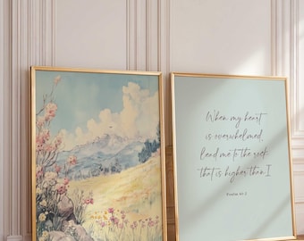 May include: Two framed art prints. One features a landscape painting with mountains, flowers, and a blue sky. The other has text that reads "When my heart is overwhelmed, lead me to the rock that is higher than I" and "Psalm 61:2".