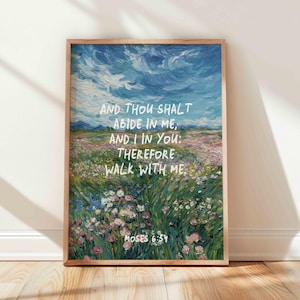 Puede incluir: Una impresión artística enmarcada que presenta una pintura de paisaje con un cielo vibrante y un campo de flores. La obra de arte incluye el texto "AND THOU SHALT ABIDE IN ME, AND I IN YOU: THEREFORE WALK WITH ME. MOSES 6:34."