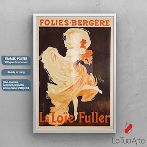 May include: Framed poster of a vintage Folies Berg&egrave;re advertisement featuring La Lo&iuml;e Fuller. The artwork depicts a dancing woman in flowing orange and yellow attire against a dark backdrop. The poster is ready to hang and has a PVC front cover.