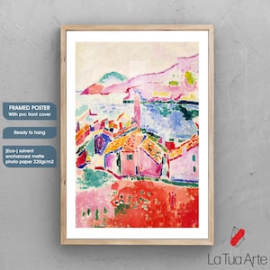 May include: Framed poster with a colorful abstract landscape painting. The artwork features a village scene with red, pink, and orange rooftops, set against a backdrop of blue water and green hills. The poster is ready to hang and has a matte finish.