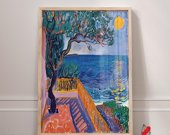 May include: A framed art print depicting a coastal scene with a vibrant blue sea under a yellow sun. A tree with green foliage and orange fruit frames the view. The artwork features a terrace with a railing and colorful details.