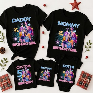 May include: Black family birthday shirts with the text "Daddy", "Mommy", "Brother", "Sister", and "Custom 5 Birthday". Each shirt features a colorful graphic of a group of animated girls. Festive holiday decorations surround the shirts.