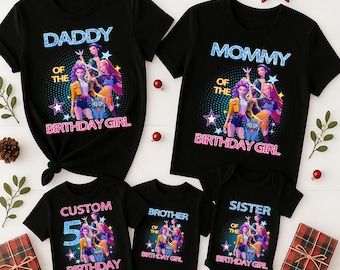 May include: Black family birthday shirts with the text "Daddy", "Mommy", "Brother", "Sister", and "Custom 5 Birthday". Each shirt features a colorful graphic of a group of animated girls. Festive holiday decorations surround the shirts.