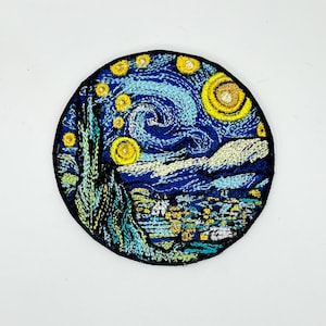 May include: Embroidered patch featuring Van Gogh's "Starry Night." The design showcases a swirling blue night sky with yellow stars and a village below. The patch has a black border and is suitable for jackets, bags, or other fabric items.