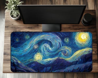 May include: A rectangular desk mat featuring a vibrant, impressionistic painting of a starry night sky in shades of blue, yellow, and white. The design includes swirling brushstrokes and a prominent crescent moon. The mat is placed on a wooden desk.