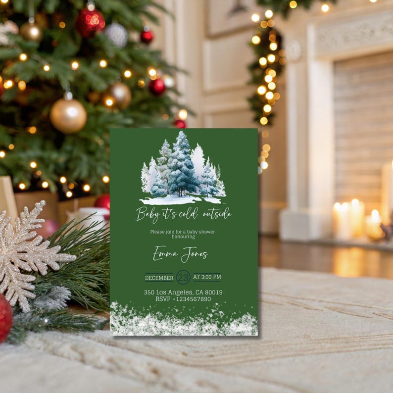 May include: A green invitation card with the text "Baby it's cold outside" and a winter forest illustration. The card includes details for a baby shower, with a date, time, and RSVP information. The card is decorated with a snowy border.