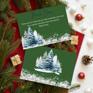 May include: Two green thank you cards with a winter forest design and the text "Thank You". The cards have a snowy forest scene and the message "Thank you for showering our little snowflake with love!"