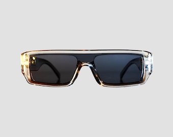 Panthéra – Gafas de sol de diseño de lujo con panteras doradas, montura futurista transparente plateada, accesorio unisex de Kaldéra