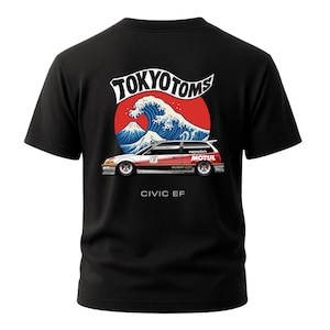 May include: Black t-shirt featuring a graphic of a red sun, a blue wave, and a white car with the text "TOKYO TOMS" and "CIVIC EF". The car has "HONDA" and "MOTUL" branding.