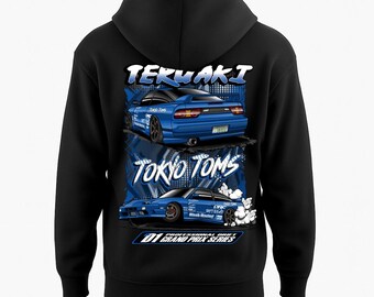 May include: Black hooded sweatshirt featuring a graphic of two blue sports cars with the text "TERUAKI" and "TOKYO TOMS" in white and blue. The design includes the text "D1 GRAND PRIX SERIES".
