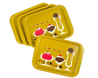 May include: A stack of four yellow dessert trays with rounded corners. Each tray features a retro design with illustrations of desserts and the words "DESSERT TRAY" in a vintage font. The trays are stacked on a white background.