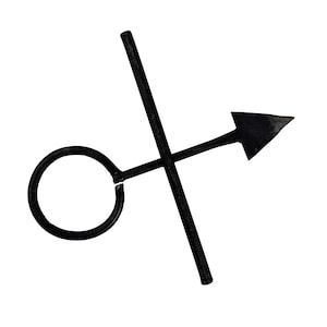 May include: A black metal object consisting of a circular ring attached to a straight rod that extends into a triangular arrow point, crossed by a second straight rod. The design features a dark, matte finish with clean, geometric lines.