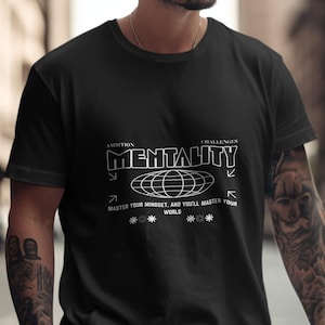 May include: Black t-shirt with a white graphic design that says "MENTALITY" with a globe and arrows. The text below the globe says "MASTER YOUR MINDSET, AND YOU'LL MASTER YOUR WORLD".