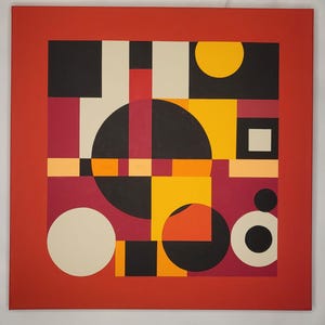 May include: Abstract geometric painting with a red border. The artwork features a central composition of black, yellow, cream, and burgundy shapes, including circles, squares, and rectangles. The design is bold and modern, with a vibrant color palette.