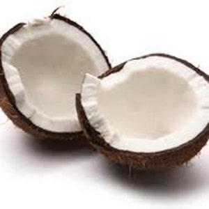 May include: Two halves of a brown coconut with white flesh inside. The coconut is cracked open and the flesh is visible.