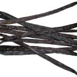 May include: A bunch of whole vanilla beans, dark brown in color, with a slightly shiny surface. The beans are arranged in a random pattern, with some overlapping.