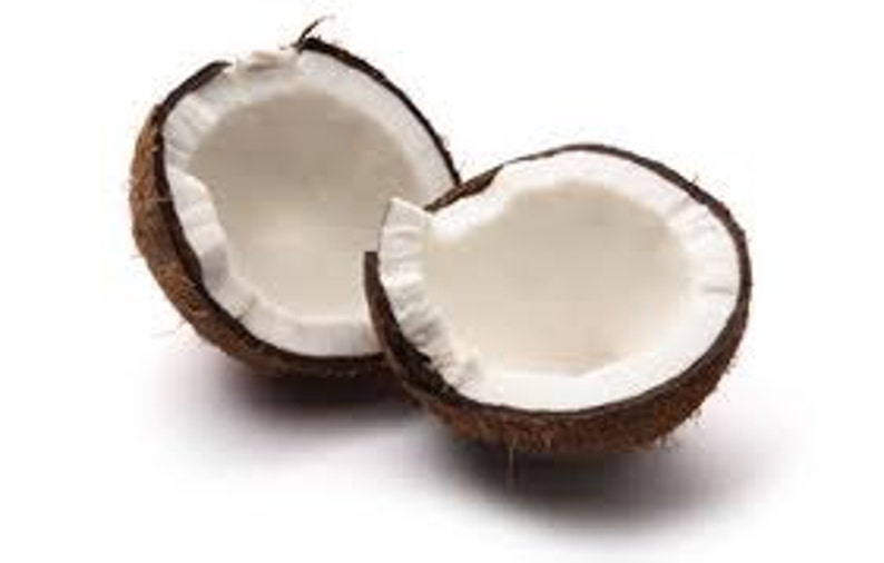 May include: Two halves of a brown coconut with white flesh inside. The coconut is cracked open and the flesh is visible.
