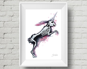 May include: Watercolor painting of a skeletal rabbit with a unicorn horn, leaping in the air. The background is a soft pink with white dots.