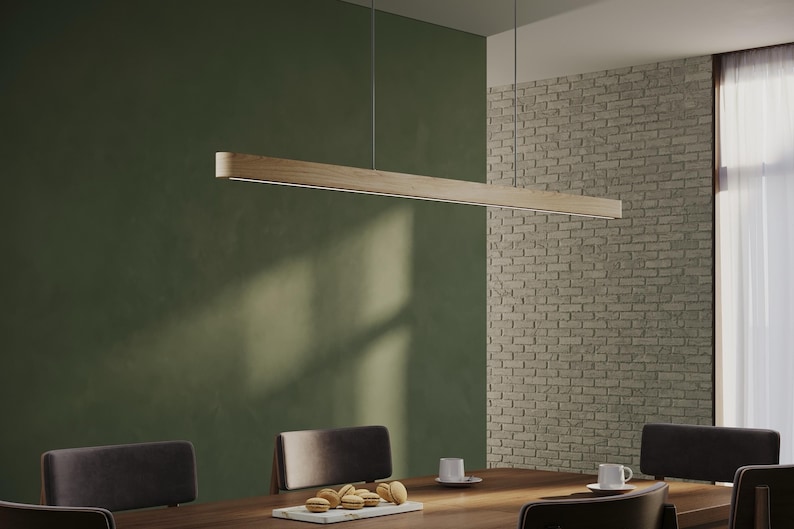 Handmade linear wooden pendant light with integrated LED, minimalist suspension luminaire above dining table, modern farmhouse chandelier made of natural wood for dining room or kitchen island.