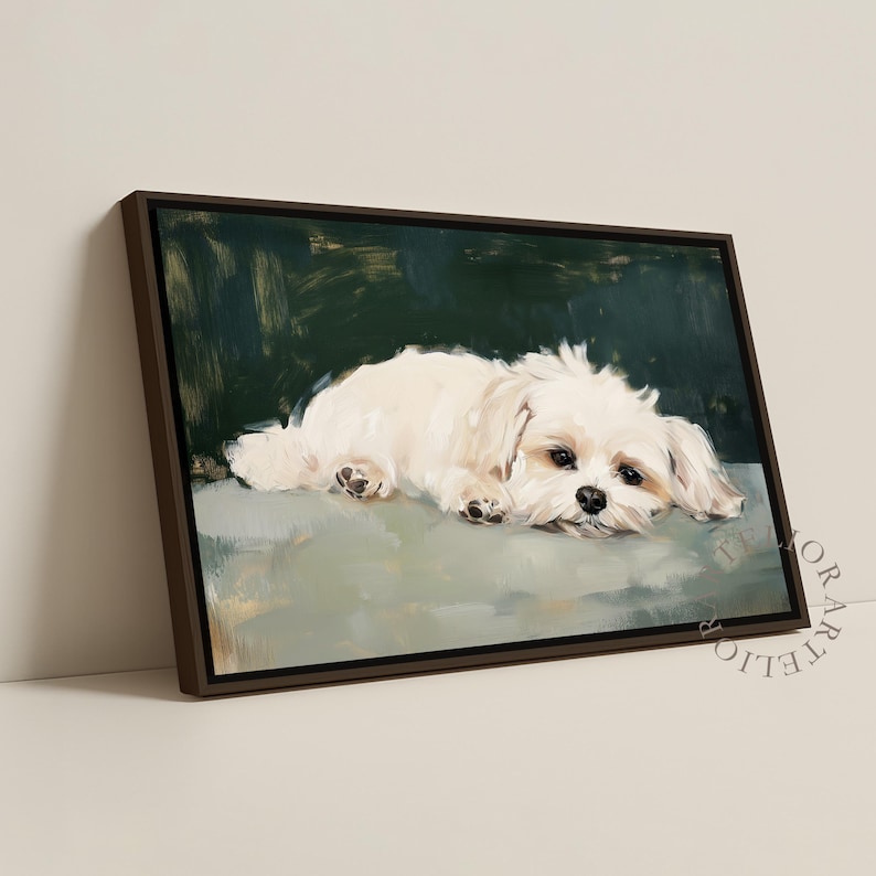 May include: A framed canvas art print featuring a white dog lying down. The dog has dark eyes and black paw pads. The background is a dark green with brushstrokes, and the dog rests on a light green surface. The frame is brown.