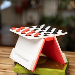 May include: A rustic wooden sign with the text "Welcome to our home" in white lettering. The sign features a distressed finish and a simple, inviting design, perfect for a front porch or entryway.