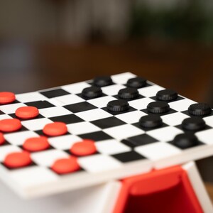 May include: A set of three ceramic mugs with a speckled, cream-colored glaze. Each mug features a different hand-painted floral design in shades of blue, green, and yellow. The mugs have a simple, rounded shape and a comfortable handle.