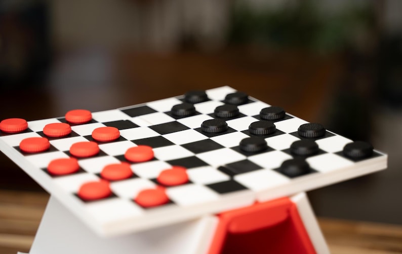 May include: A set of three ceramic mugs with a speckled, cream-colored glaze. Each mug features a different hand-painted floral design in shades of blue, green, and yellow. The mugs have a simple, rounded shape and a comfortable handle.