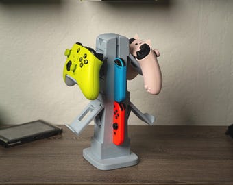 Torre de control de 4 lados: organizador de juegos para Xbox, PlayStation, Switch y Switch 2. Soporte para Joy-Cons/auriculares y soporte para control.