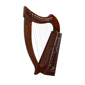 May include: A brown wooden Celtic harp with a carved design on the soundboard. The harp has 22 strings and is a traditional Irish musical instrument.