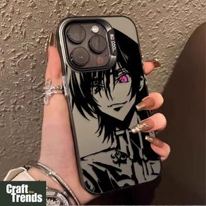 May include: Black and gray phone case featuring an anime character with pink eyes. The case has a black border and a clear back. The text "GO COOL" is printed on the top right corner. The case is held by a person.
