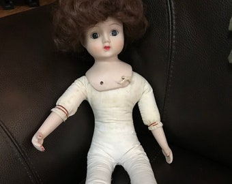 Porcelain Doll Curly Brown Hair Cloth Body Porcelain Arms, Feet  Painted Face Glass Eyes  Vintage 1960s  16 inches