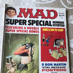 May include: A vintage MAD Super Special magazine, Number Seventeen, featuring a cartoon illustration of a man with a pipe and a detective hat. The cover also includes the text "Send a Kid to Camp" and "8 Don Martin Posters."
