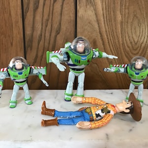 4 Toy Story Figures, 3 Buzz Lightyear, Woody Thinkway Toys Vintage 1990s Burger King Toys Movie Cartoon Character Collectible Toys