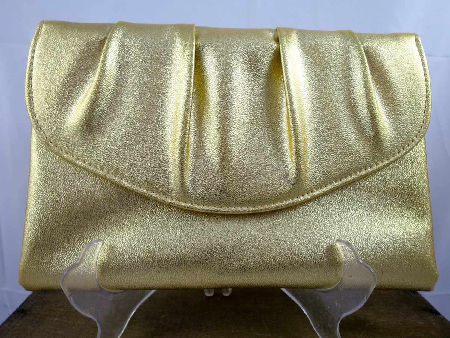 Soft gold shop clutch bag