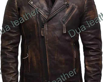 May include: A distressed brown leather jacket with an asymmetrical zipper closure and a notched lapel. The jacket features multiple zippered pockets and quilted shoulder detailing. The leather has a worn, vintage appearance.