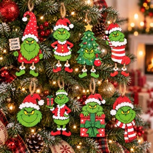 May include: A set of eight wooden Christmas tree ornaments featuring a green character in various poses, including wearing a Santa hat, holding a gift, emerging from a stocking, and standing next to a sign that reads STINK STANK STUNK.