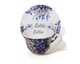 Taza de té y platillo de porcelana fina con nomeolvides personalizados