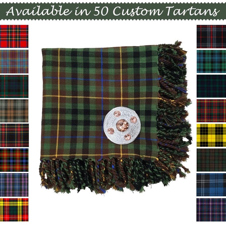 May include: A green, black, and brown tartan scarf with a decorative silver brooch. The scarf has a fringed edge and is displayed with several tartan pattern samples. Text reads "Available in 50 Custom Tartans."