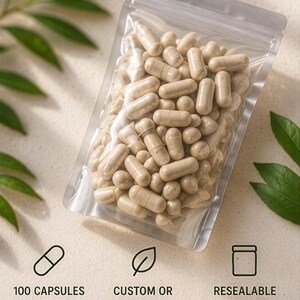 May include: A clear, resealable bag filled with beige capsules. The bag is labeled with the text "100 CAPSULES", "CUSTOM OR PRE-MADE", and "RESEALABLE BAG". The background features green leaves.