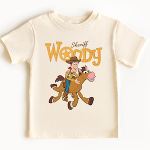 May include: A handmade wooden sign with the text "Welcome" in a playful font. The sign features a distressed finish and a natural wood grain background, perfect for a front door or entryway. It measures approximately 12 inches wide.