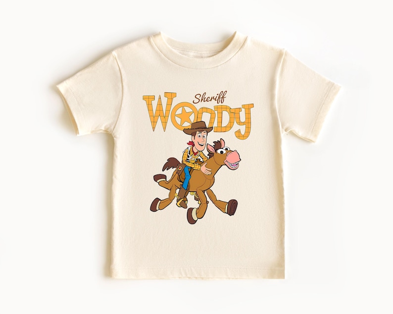 May include: A handmade wooden sign with the text "Welcome" in a playful font. The sign features a distressed finish and a natural wood grain background, perfect for a front door or entryway. It measures approximately 12 inches wide.