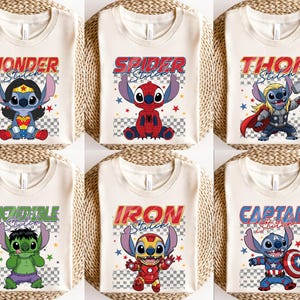 May include: Six cream-colored t-shirts with cartoon character designs. Each shirt features a different superhero-themed Stitch character with text above. The designs include Wonder, Spider, Thor, Incredible, Iron, and Captain Stitch.