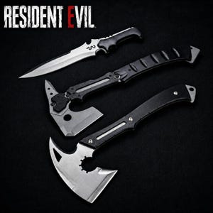 May include: An assortment of three black and silver metal weapons, including a knife and two axes, are displayed against a black background. The text "RESIDENT EVIL" is in white letters at the top left.
