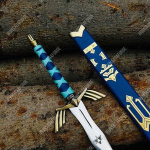 May include: A detailed image of a fantasy sword with a silver blade and gold accents. The hilt is wrapped in blue and turquoise leather. The blue scabbard has gold symbols. The sword is displayed on a background of wooden logs. The text "IRONSAGAFORGE" is visible.