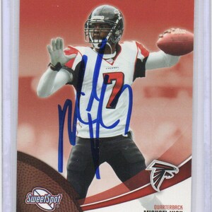 Cartão de futebol autografado por Michael Vick e assinado pelos Falcons