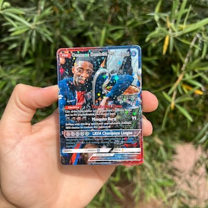 Cartão estilo Pokémon GX da Liga dos Campeões da UEFA de Ousmane Dembélé PSG