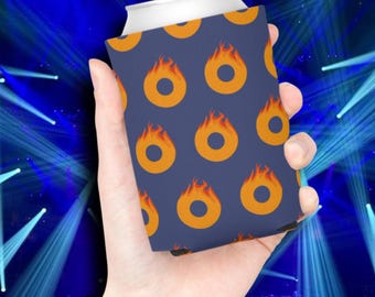 May include: A navy blue can cooler featuring a repeating pattern of orange flames. The cooler is designed to hold a standard-sized beverage can. The background is a blurred image of a concert stage with blue lights.