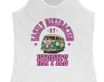 May include: White racerback tank top with a graphic that reads "Easily Distracted - By - Hippies." The graphic features a retro-style teal and brown van with flower accents and the word "Love."