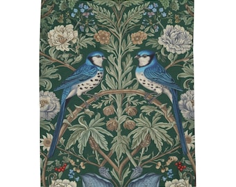 May include: A decorative textile featuring two blue birds perched on a branch, set against a dark green background with floral and foliage patterns. The birds have white speckled markings and long blue tails. The design includes white and tan flowers.
