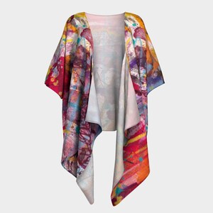 May include: A colorful abstract print kimono with a long, flowing design. The kimono is made of a lightweight fabric and has a relaxed fit.